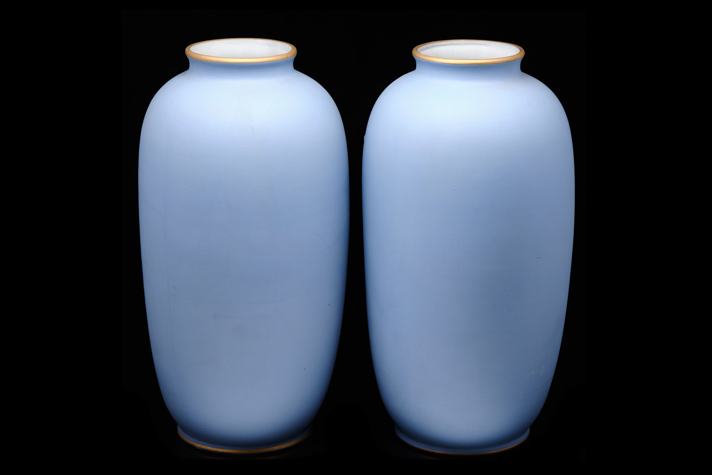 Pair of two faced jugs